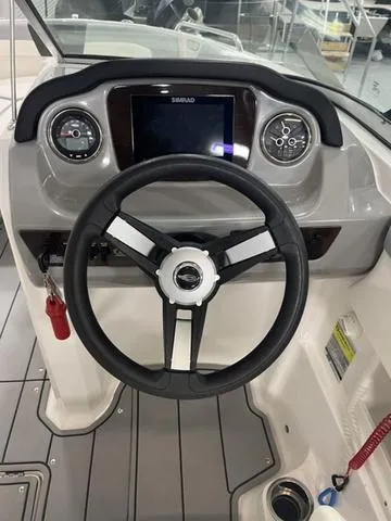 Slide: The Image of Steering wheel and dashboard of 2022 Chaparral 23 SSi boat. - 9