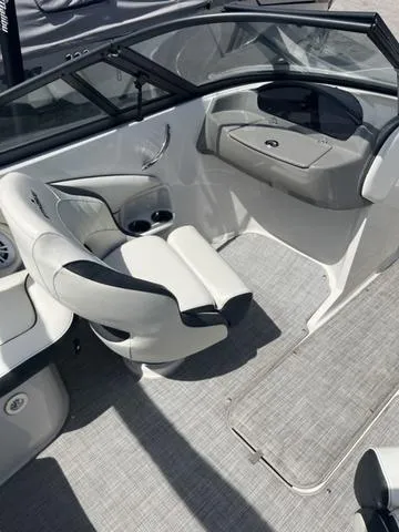 Slide: The Image of 2020 Stingray 208LR boat interior with modern seating and dashboard design. - 12