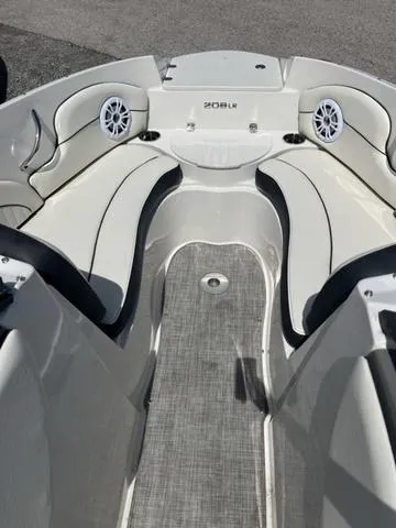 Slide: The Image of 2020 Stingray 208LR boat interior with seating and speakers. - 13