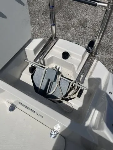 Slide: The Image of Stingray 208LR 2020 boat anchor storage area with ladder and ropes. - 17