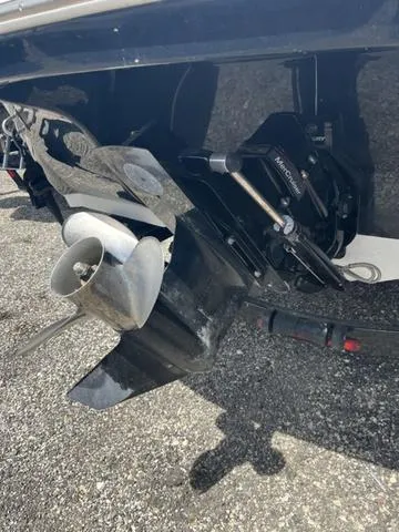 Slide: The Image of 2020 Stingray 208LR boat propeller and outdrive on a gravel surface. - 5