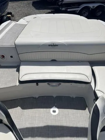 Slide: The Image of 2020 Stingray 208LR boat interior with white seating and sleek design. - 7