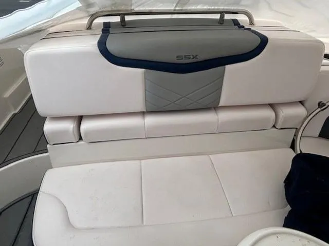 Slide: The Image of 2020 Chaparral 257 SSX boat interior with white cushioned seating. - 13