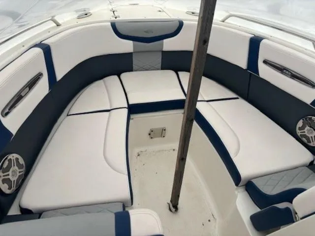 Slide: The Image of 2020 Chaparral 257 SSX boat interior with white and blue seating. - 9