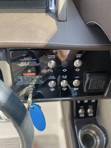 Slide: The Image of Control panel of a 2016 Sea Ray 280 SLX boat with key and switches. - 16
