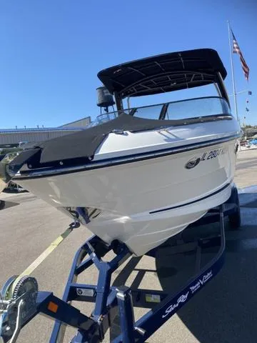 Slide: The Image of 2016 Sea Ray 280 SLX boat on trailer, parked outdoors under clear blue sky. - 9