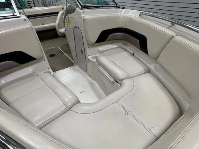 Slide: The Image of 1997 Chaparral 2130 SS boat interior with white leather seating and sleek design. - 10