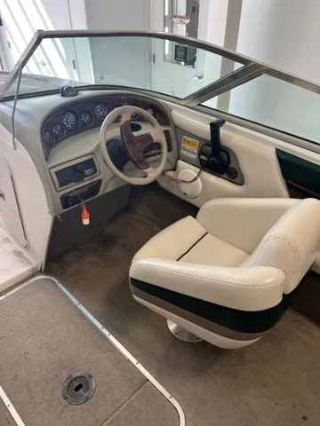 Slide: The Image of 1997 Chaparral 2130 SS boat interior with steering wheel and captain's chair. - 13