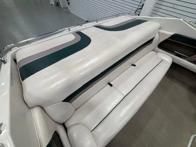 Slide: The Image of 1997 Chaparral 2130 SS boat interior with white and green seating. - 15