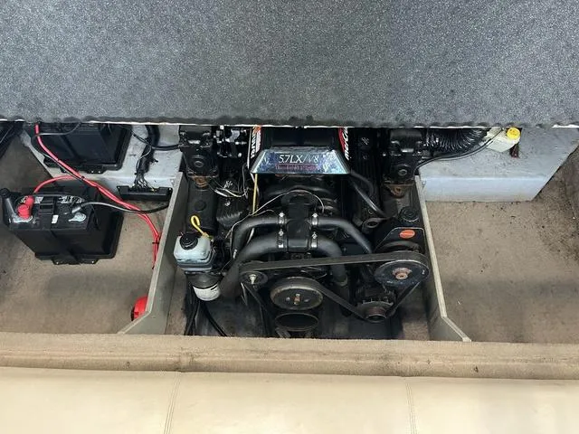 Slide: The Image of Engine compartment of a 1997 Chaparral 2130 SS boat, showing battery and wiring. - 17