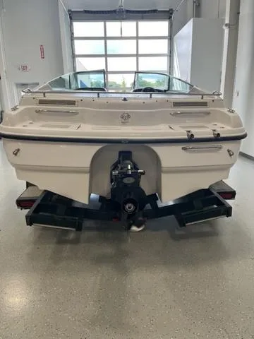 Slide: The Image of 1997 Chaparral 2130 SS boat, rear view in a garage setting. - 19