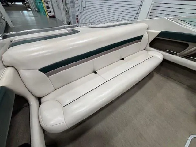 Slide: The Image of 1997 Chaparral 2130 SS boat interior with white and green seating. - 21