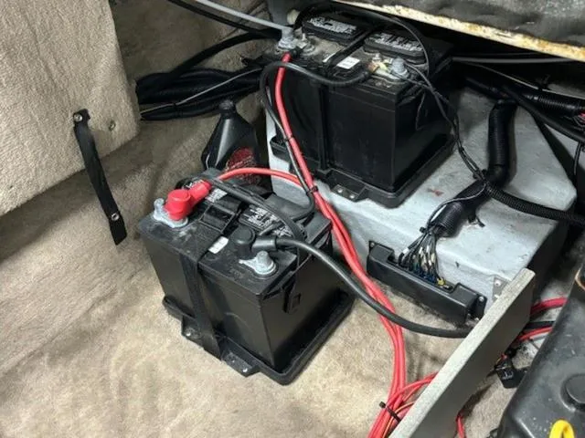 Slide: The Image of 1997 Chaparral 2130 SS boat battery compartment with wiring and dual batteries. - 26