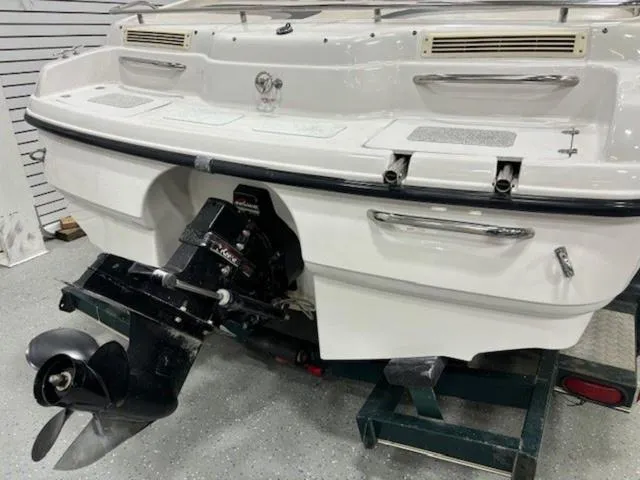 Slide: The Image of 1997 Chaparral 2130 SS boat stern with outboard motor in a showroom. - 27
