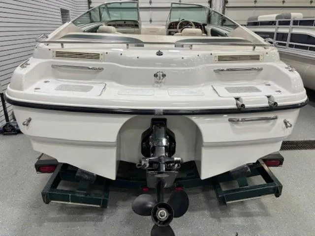 Slide: The Image of 1997 Chaparral 2130 SS boat, rear view in a garage setting. - 28