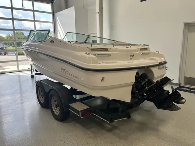 Slide: The Image of 1997 Chaparral 2130 SS boat on trailer in indoor showroom. - 4