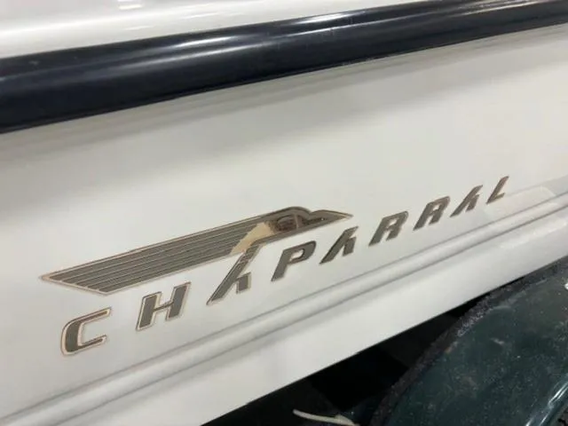 Slide: The Image of 1997 Chaparral 2130 SS boat logo on white hull. - 5