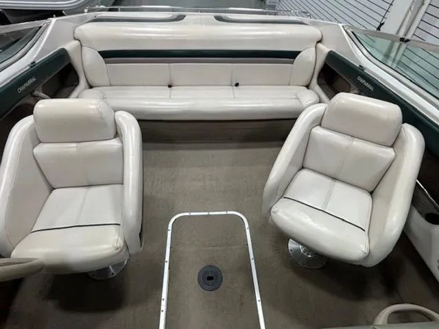 Slide: The Image of 1997 Chaparral 2130 SS boat interior with white leather seats and spacious layout. - 9