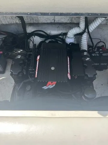 Slide: The Image of Engine compartment of a 1999 Rinker 212 Bowrider Captiva boat. - 4