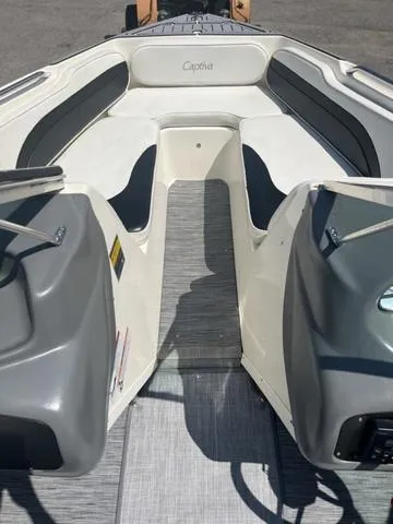 Slide: The Image of 1999 Rinker 212 Bowrider Captiva interior, featuring spacious seating and sleek design. - 6