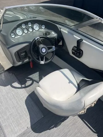 Slide: The Image of 1999 Rinker 212 Bowrider Captiva dashboard and steering wheel interior view. - 8