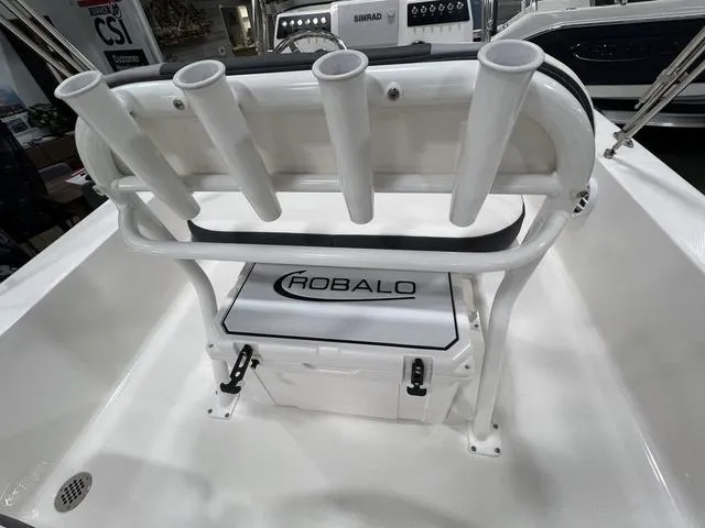 Slide: The Image of 2024 Robalo 206 Cayman boat interior with rod holders and storage compartment. - 10