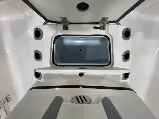 Slide: The Image of 2024 Robalo 206 Cayman boat interior, featuring a spacious storage compartment and sleek design. - 15