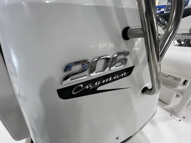 Slide: The Image of 2024 Robalo 206 Cayman boat logo on white surface. - 16