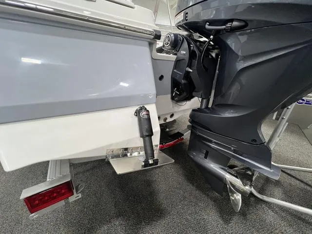 Slide: The Image of 2024 Robalo 206 Cayman boat engine and propeller detail. - 6