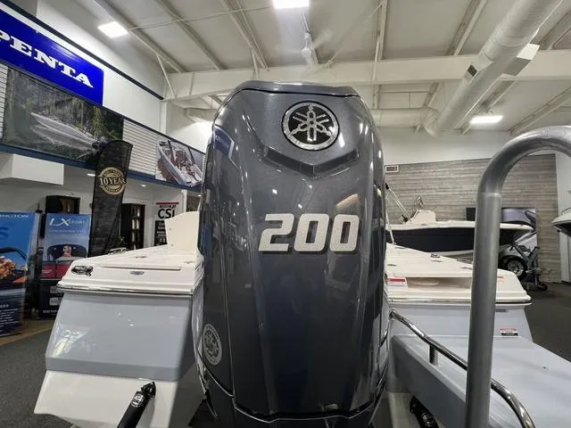 Slide: The Image of 2024 Robalo 206 Cayman with Yamaha 200 engine in showroom. - 7