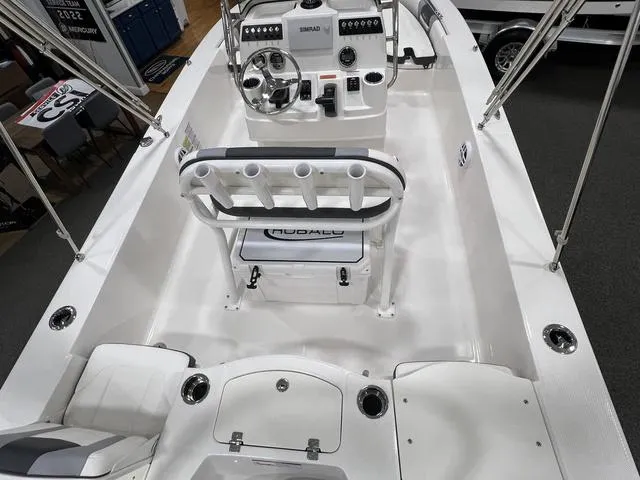 Slide: The Image of 2024 Robalo 206 Cayman boat interior with steering console and seating arrangement. - 9
