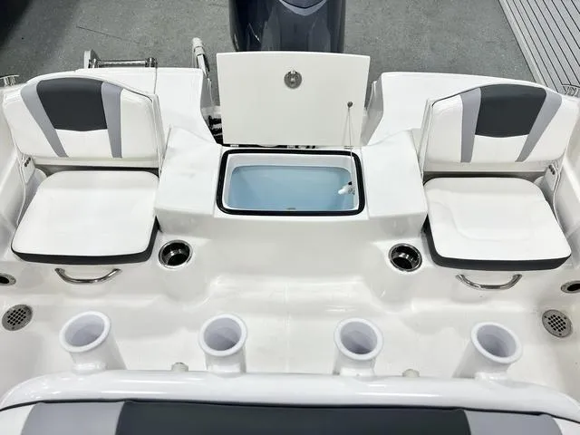 Slide: The Image of 2024 Robalo R180 boat interior with seating and storage compartments. - 15