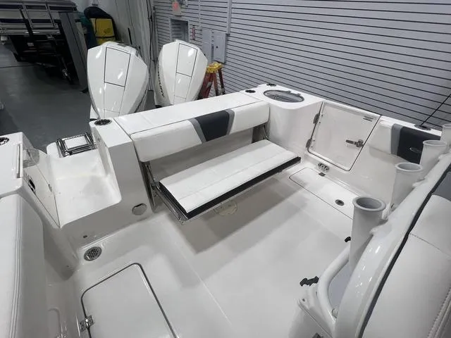 Slide: The Image of 2024 Robalo R250 boat interior with seating and storage compartments. - 10