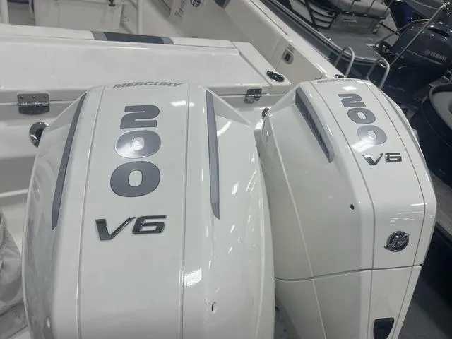 Slide: The Image of 2024 Robalo R250 boat with twin Mercury 200 V6 outboard engines. - 4