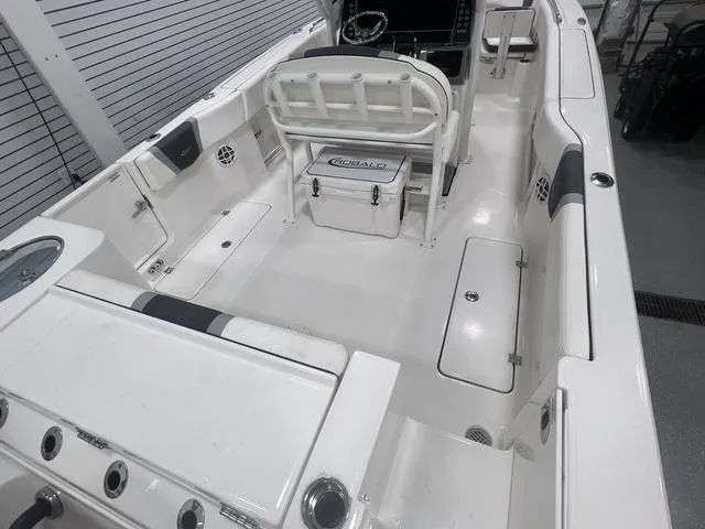 Slide: The Image of 2024 Robalo R250 boat interior with spacious seating and storage compartments. - 9