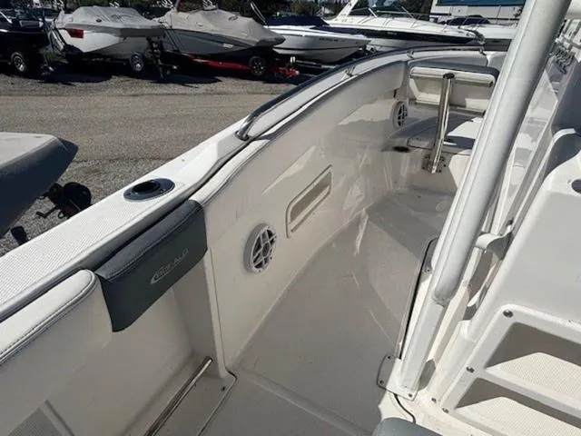 Slide: The Image of 2021 Robalo R222 boat interior with sleek design and spacious seating area. - 12