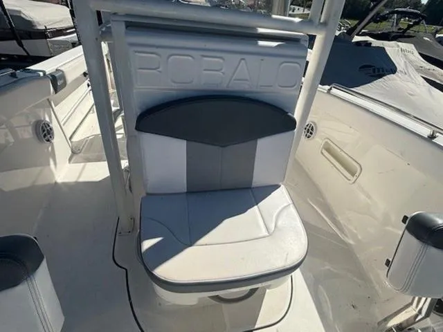 Slide: The Image of 2021 Robalo R222 boat seat with embossed logo, white and gray upholstery. - 18