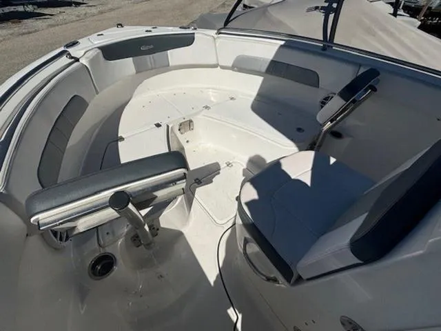 Slide: The Image of 2021 Robalo R222 boat interior with seating and steering area. - 19