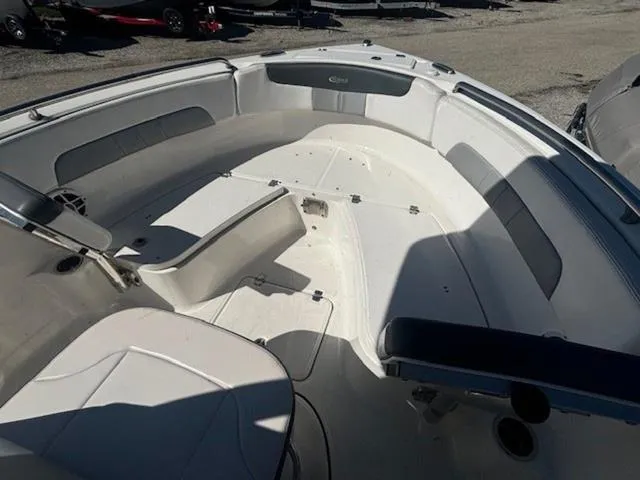 Slide: The Image of 2021 Robalo R222 boat interior with seating and storage compartments. - 20