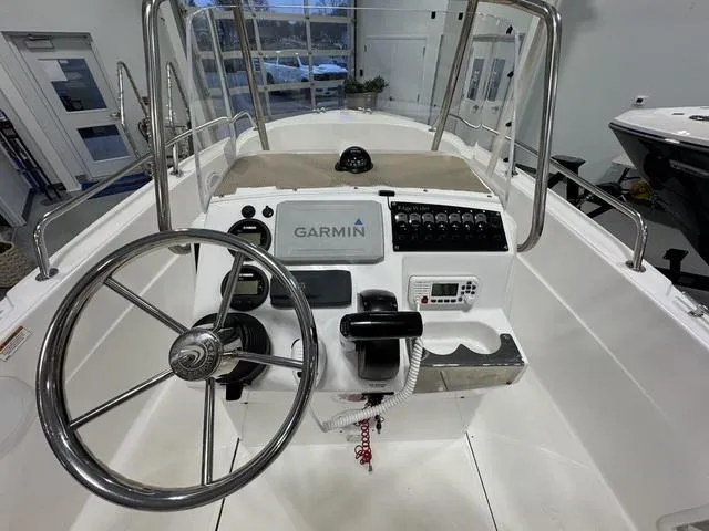 Slide: The Image of 2019 Edgewater 170CC boat console with Garmin navigation system and steering wheel. - 12