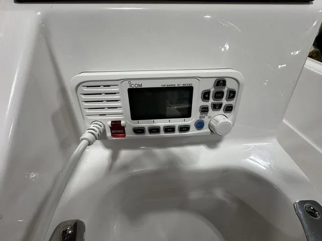 Slide: The Image of VHF marine radio on 2019 Edgewater 170CC boat dashboard. - 14