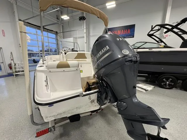 Slide: The Image of 2019 Edgewater 170CC boat with Yamaha outboard motor in showroom. - 5
