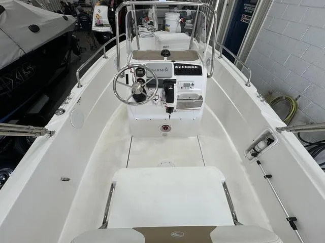 Slide: The Image of 2019 Edgewater 170CC boat interior with steering console and seating. - 6