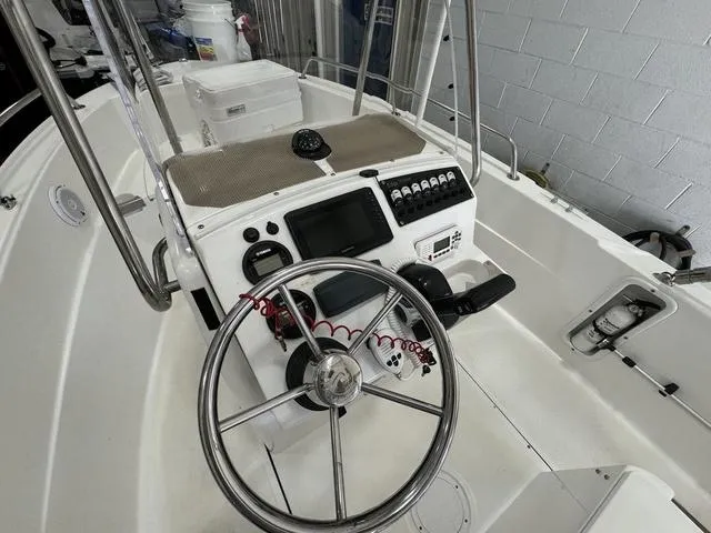 Slide: The Image of Edgewater 170CC 2019 boat console with steering wheel and navigation controls. - 7