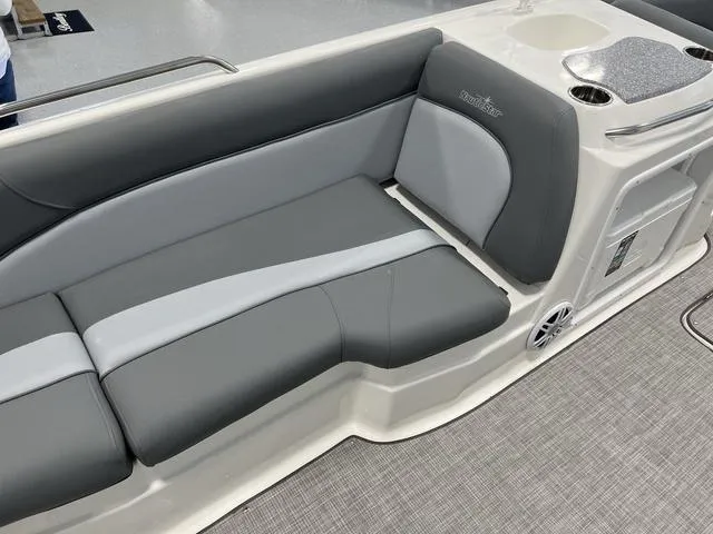 Slide: The Image of 2023 NauticStar 203 SC boat interior with gray seating and cup holders. - 10