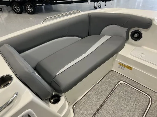 Slide: The Image of 2023 NauticStar 203 SC boat interior with gray cushioned seating and cup holders. - 14