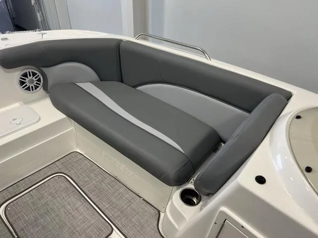Slide: The Image of 2023 NauticStar 203 SC boat interior with gray seating and speaker. - 15