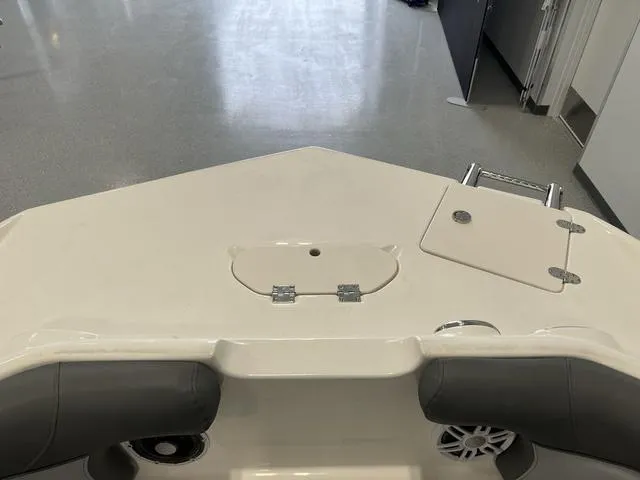 Slide: The Image of 2023 NauticStar 203 SC boat interior, featuring seating and storage compartments. - 16