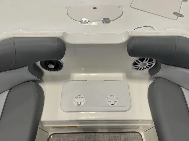 Slide: The Image of 2023 NauticStar 203 SC boat interior with gray seating and built-in speakers. - 17