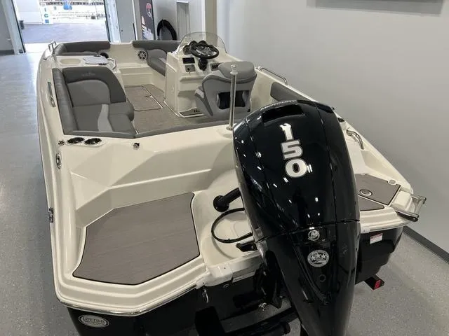 Slide: The Image of 2023 NauticStar 203 SC boat with 150 HP engine, sleek interior design. - 4